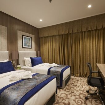Deluxe room with 2 king size beds for 4 guests at Reddy Sathram Hotel Srisailam – Family and pilgrim stay